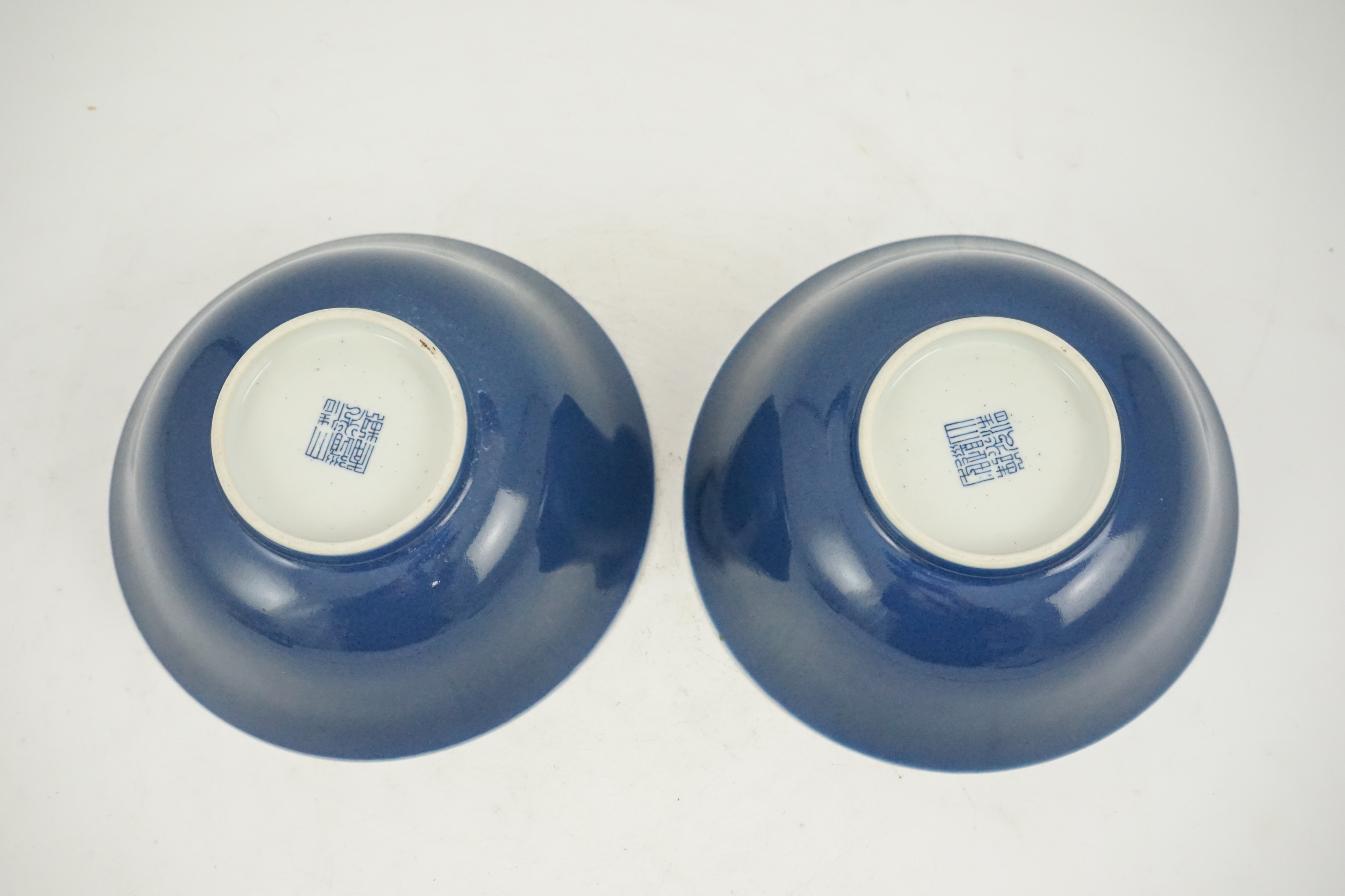 A pair of Chinese powder blue glazed bowls, Daoguang mark and of the period (1821-50)